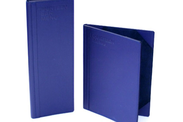 This set of menus was created for PWC in London, for the in house dining room for clients. We used a special leather from the USA to create a set of stunning menus. We used a matching blue suede for the lining with corner mounts to create the highest possible quality. We used a hot foil stamp with a clear varnish to indent the logo into the front covers.