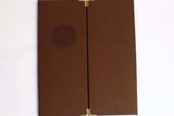 This menu was made for Chai Wu an asian fusion venue in Harrods. Nice bonded leather with brass corners and circular de-bossed logo.