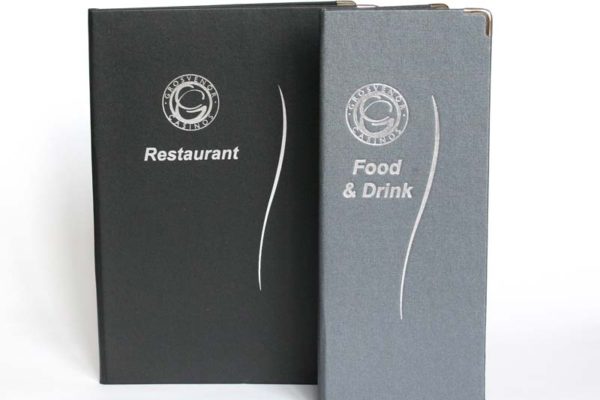 Two sizes of menus for Grosvenor casinos. Metallic Buckram, Silver Foil blocked logo. Metal corners for longevity. A4 menu cover and Cocktail sized drinks menu.